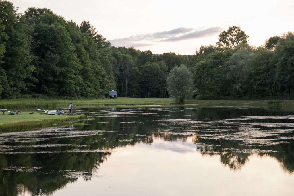 A boy fishes at the pond at the Finger Lakes Campground in Prattsburgh, New York.