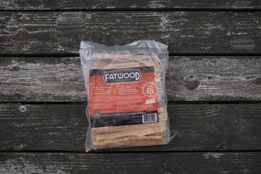 A package of Fatwood Firestarters on top of a campground picnic table.