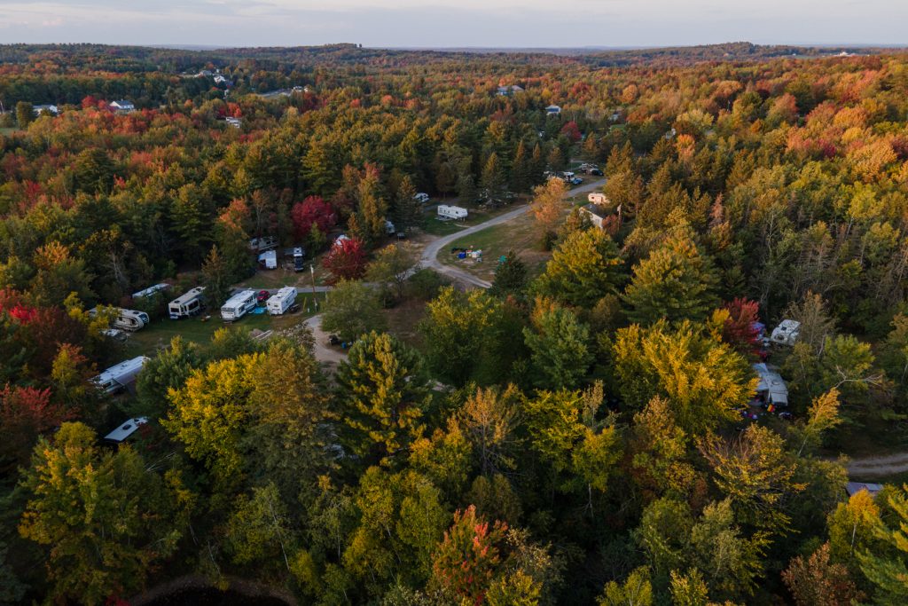 A birds-eye view of Maine's fall foliage and a campground below in Hermon, Maine.