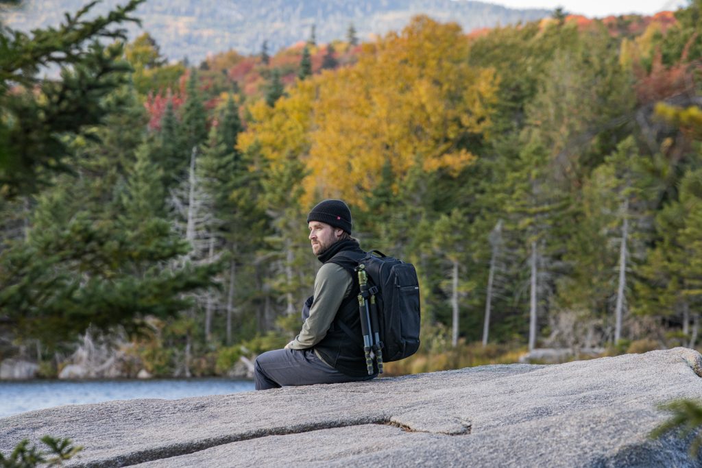 A man looks for moose at Baxter State park while also admiring the fall foliage.