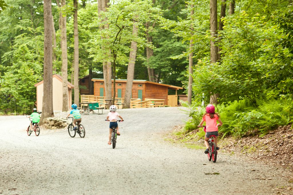 Kids riding bikes around the campground.