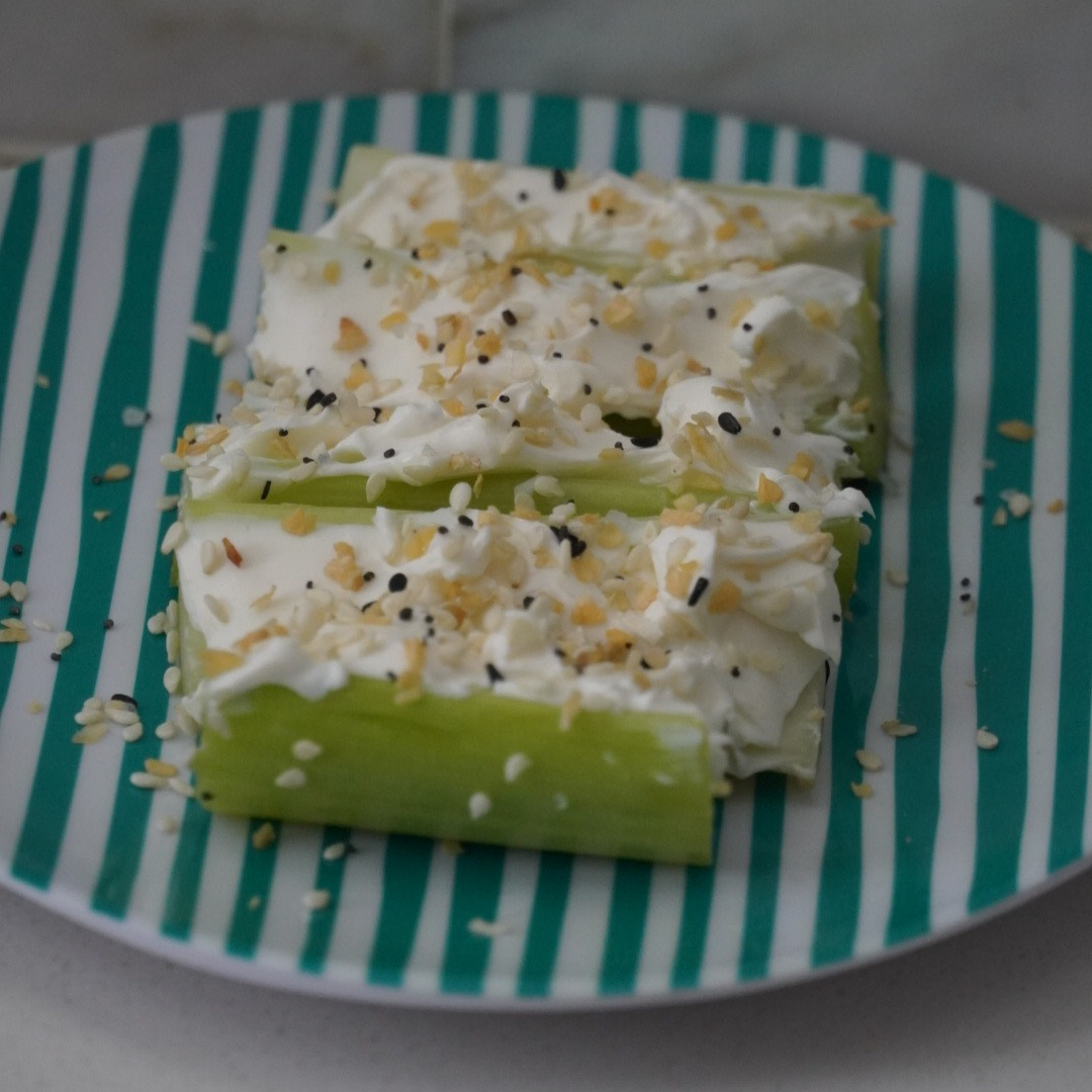 Celery boats - filled with cream cheese topped with seasoning.