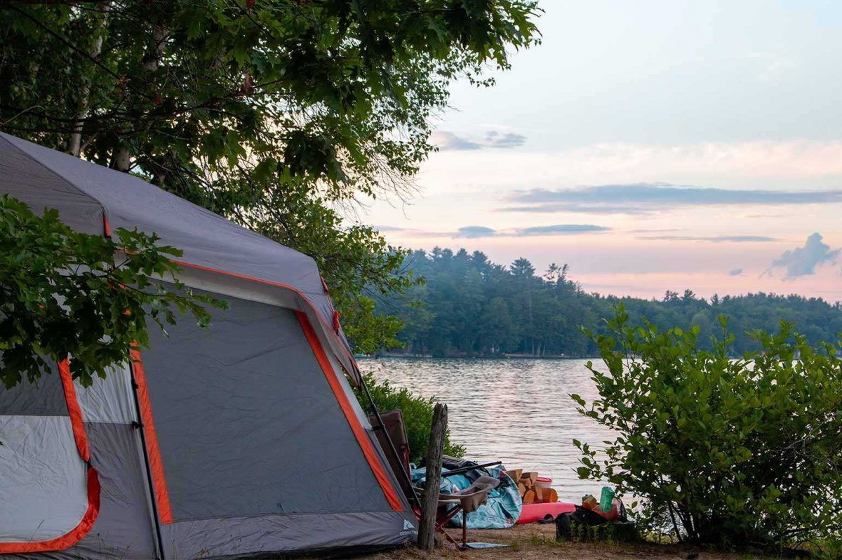 Lakeside tent site at Yogi Bear Jellystone Park Lakes Region.