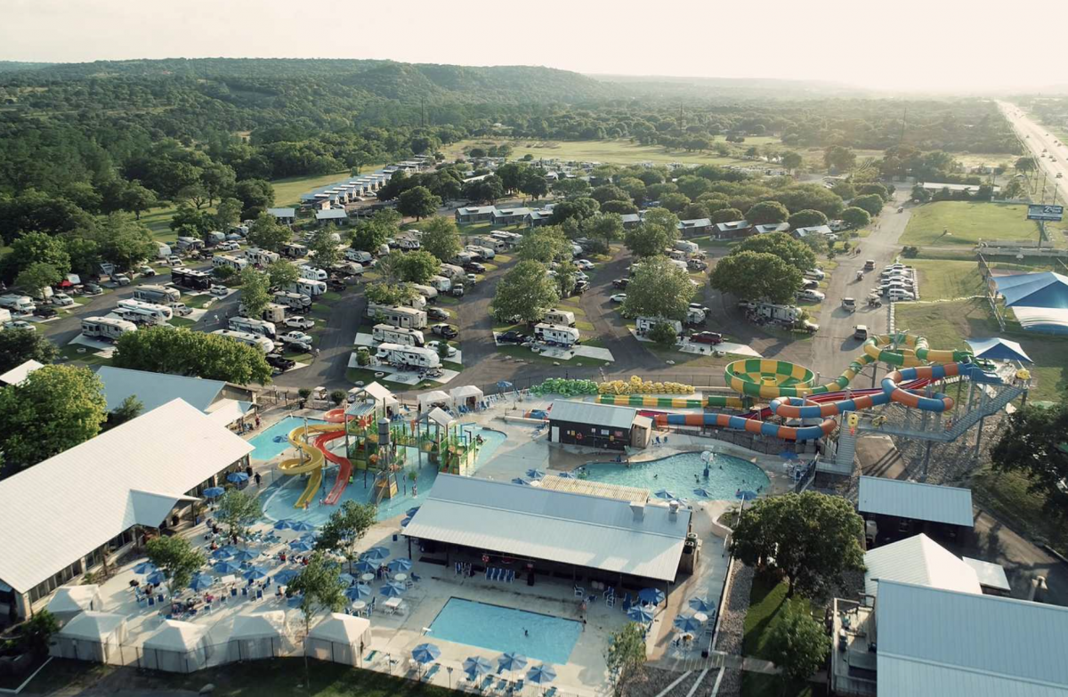 Ariel view of the campground featuring a pool and RV campsites