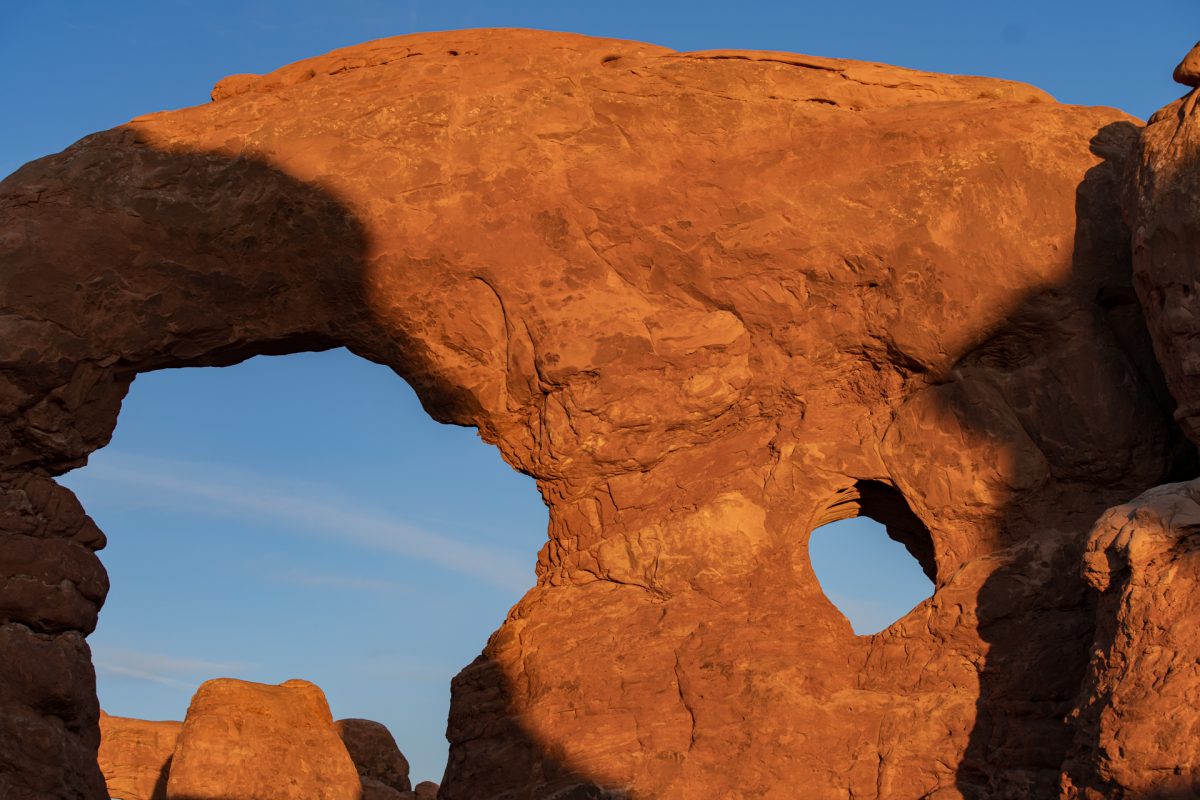Sun begins to set on Turret Arch in Arches National Park in Moab, Utah. 