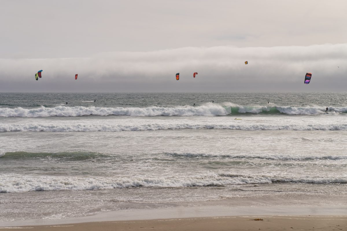Kitesurfers surfing in the Pacific Ocean at Big Basin State Park near Santa Cruz, California.