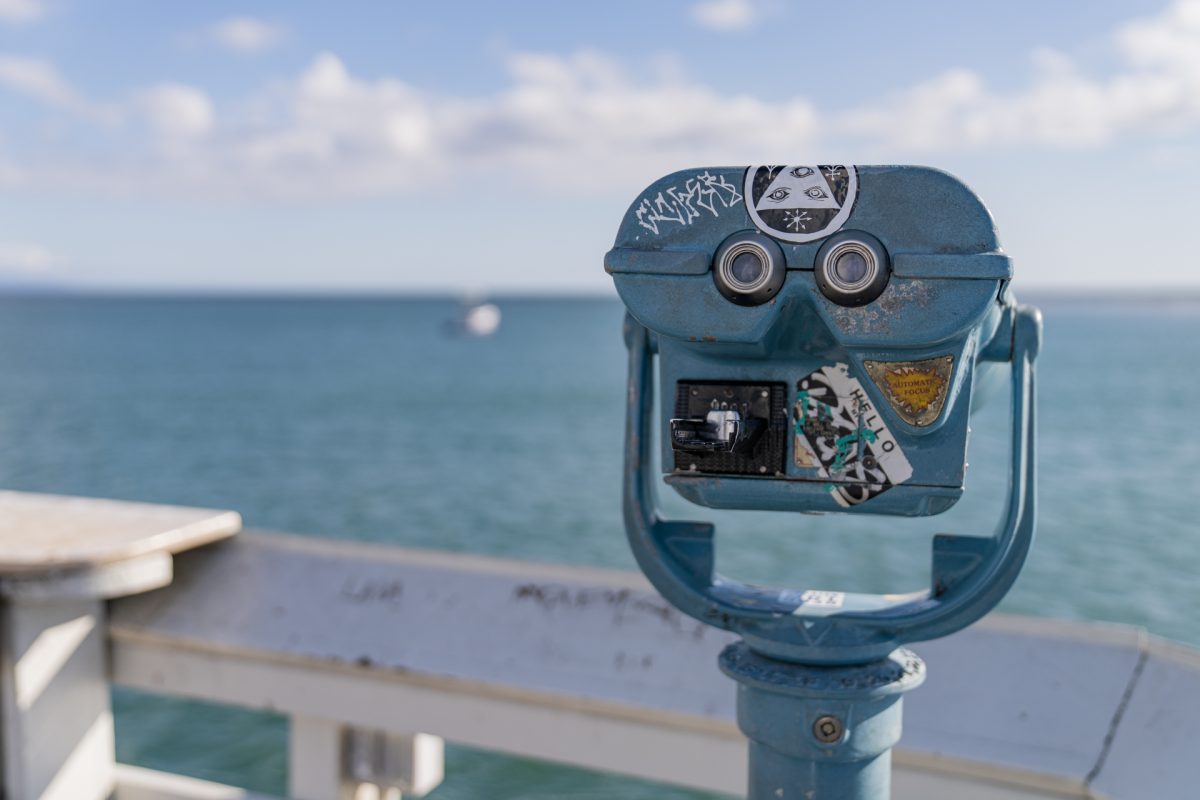 Coin-operated binoculars looking out to Monterey Bay on the Santa Cruz Wharf in Santa Cruz, California.