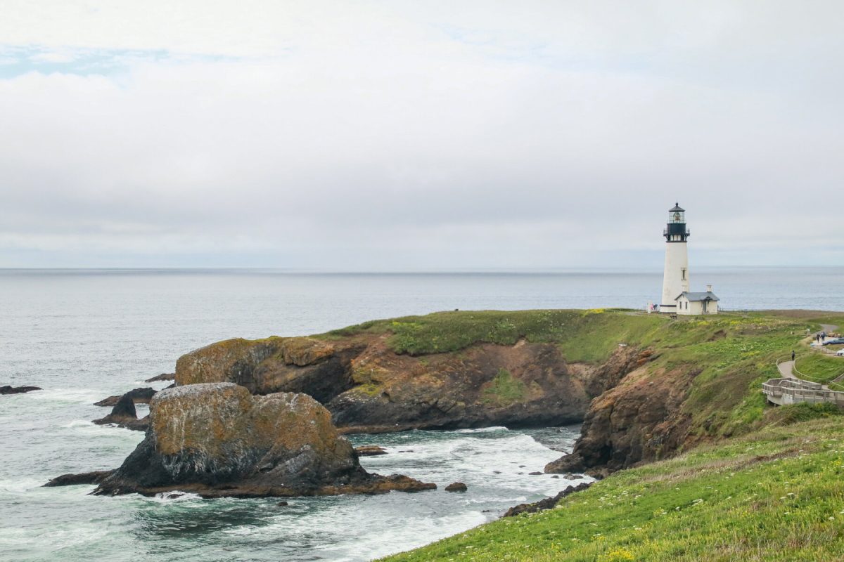 The oldest lighthouse in Oregon, the Yaquina Head Lighthouse overlooks the Oregon Coast, a popular Oregon camping destination.