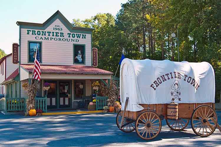 Covered wagon sits outside of Frontier Town Campground 