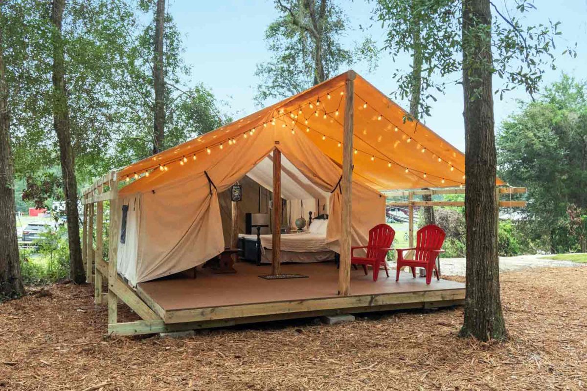 A glamping tent with string lights at Moonshine Acres RV Park. 