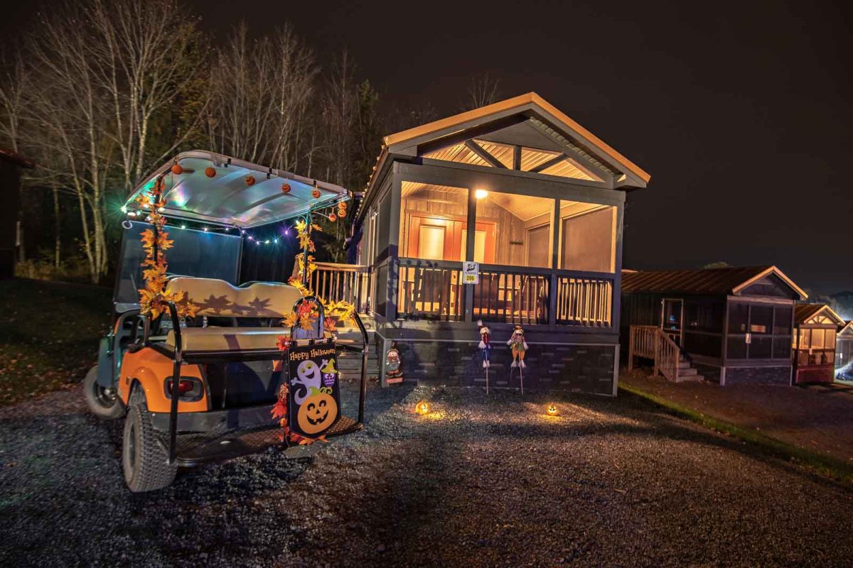 Decorated Halloween camping lodge and golf cart 