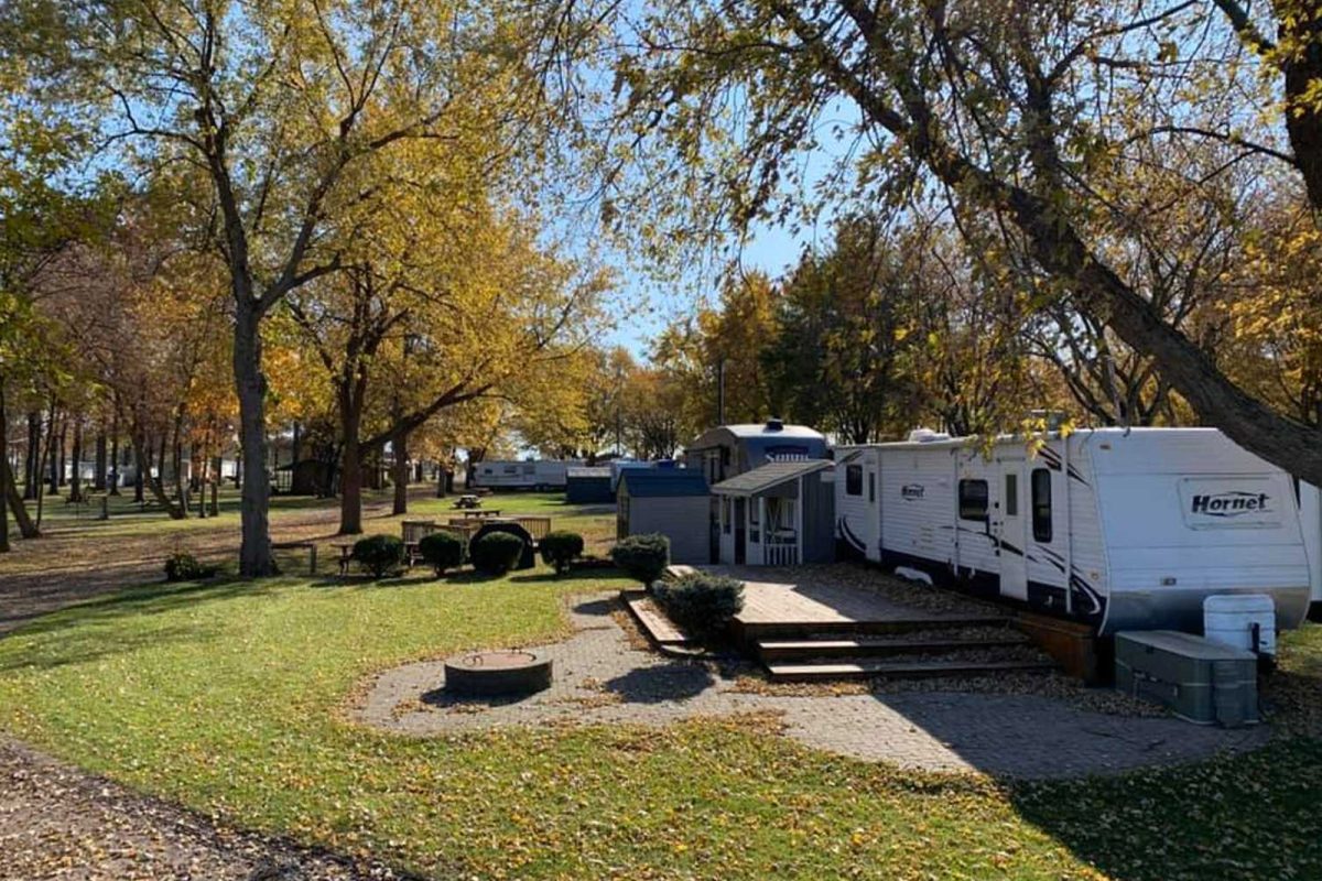 RVs surrounded by fall leaves on campground near NFL stadiums