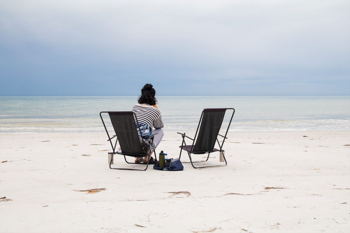 woman sitting at beach 