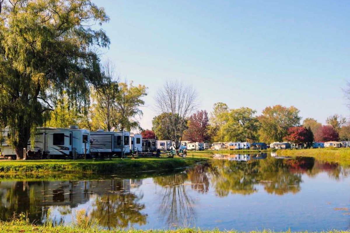 RVs parked by lake surrounded by trees in Rochester, New York