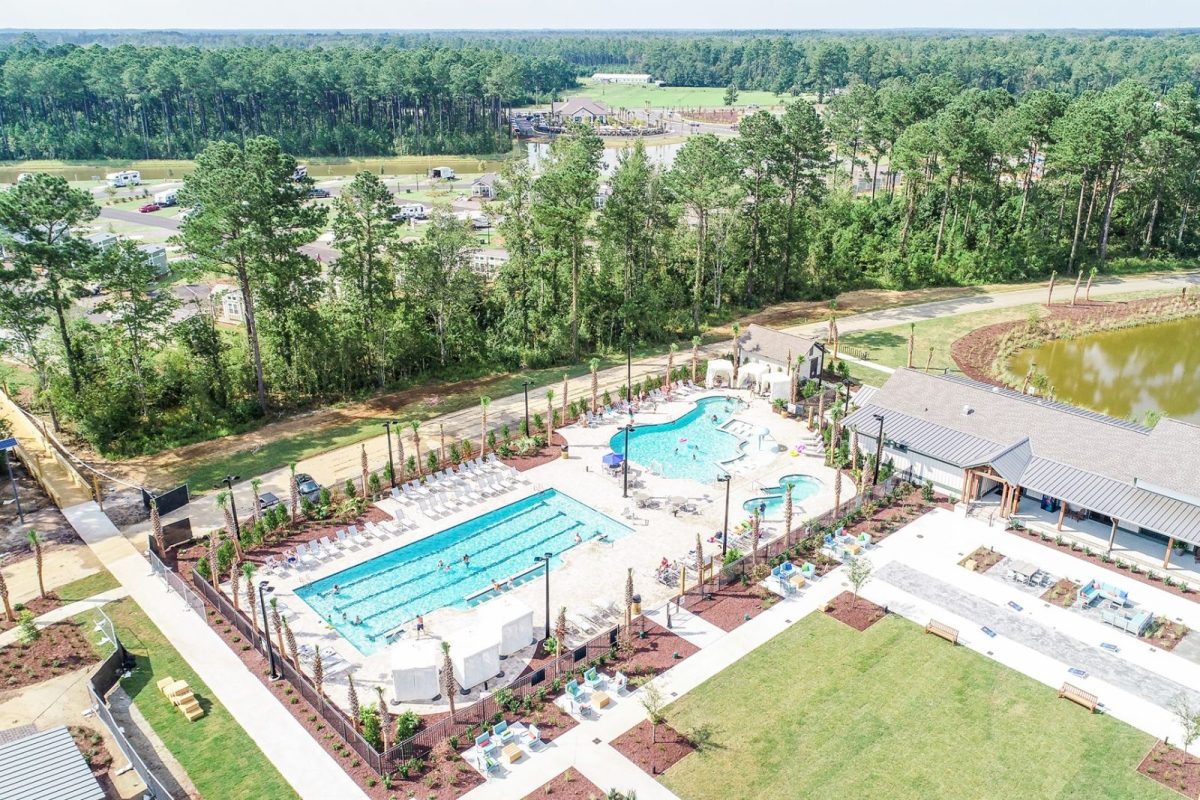 aerial view of pool and campground surrounded by trees
