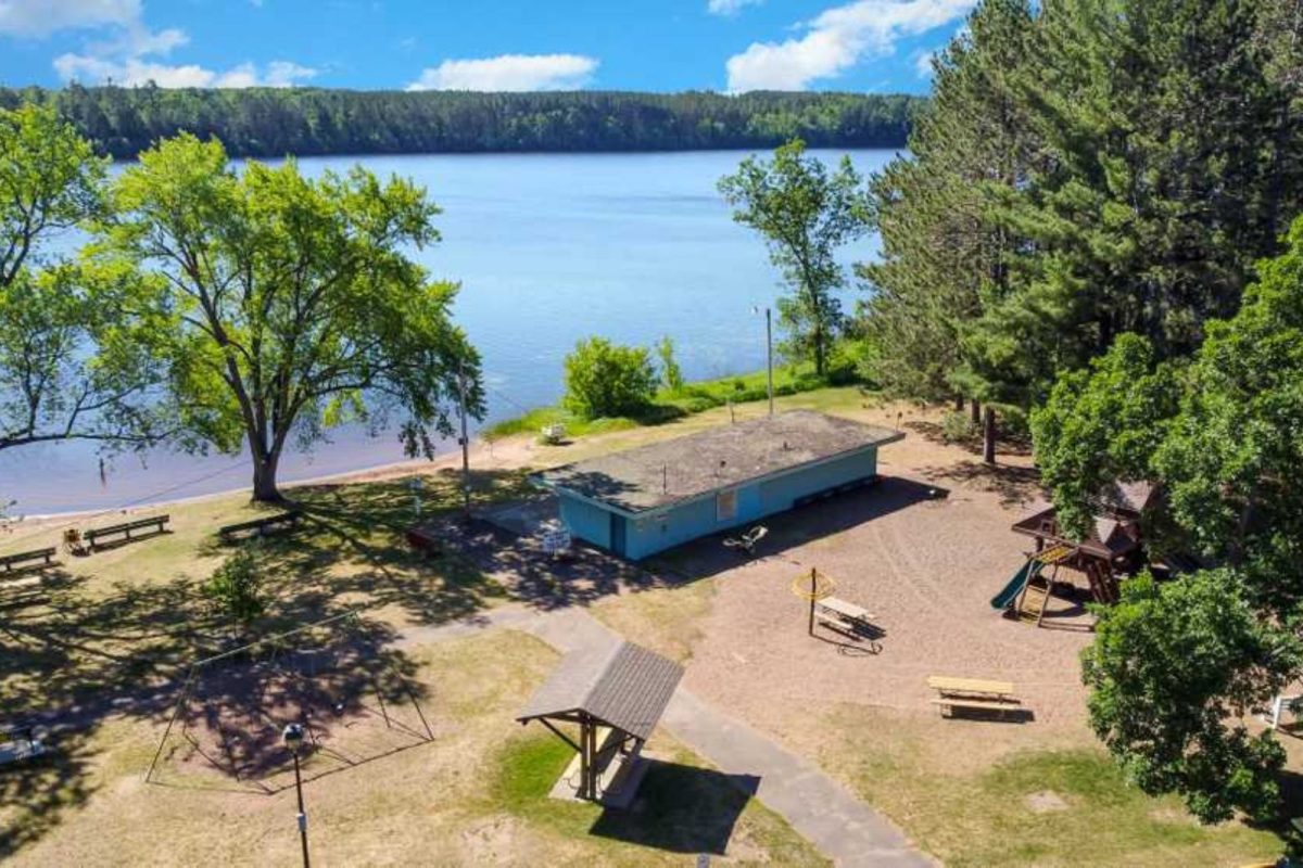 An aerial view of a lakeside campground. 