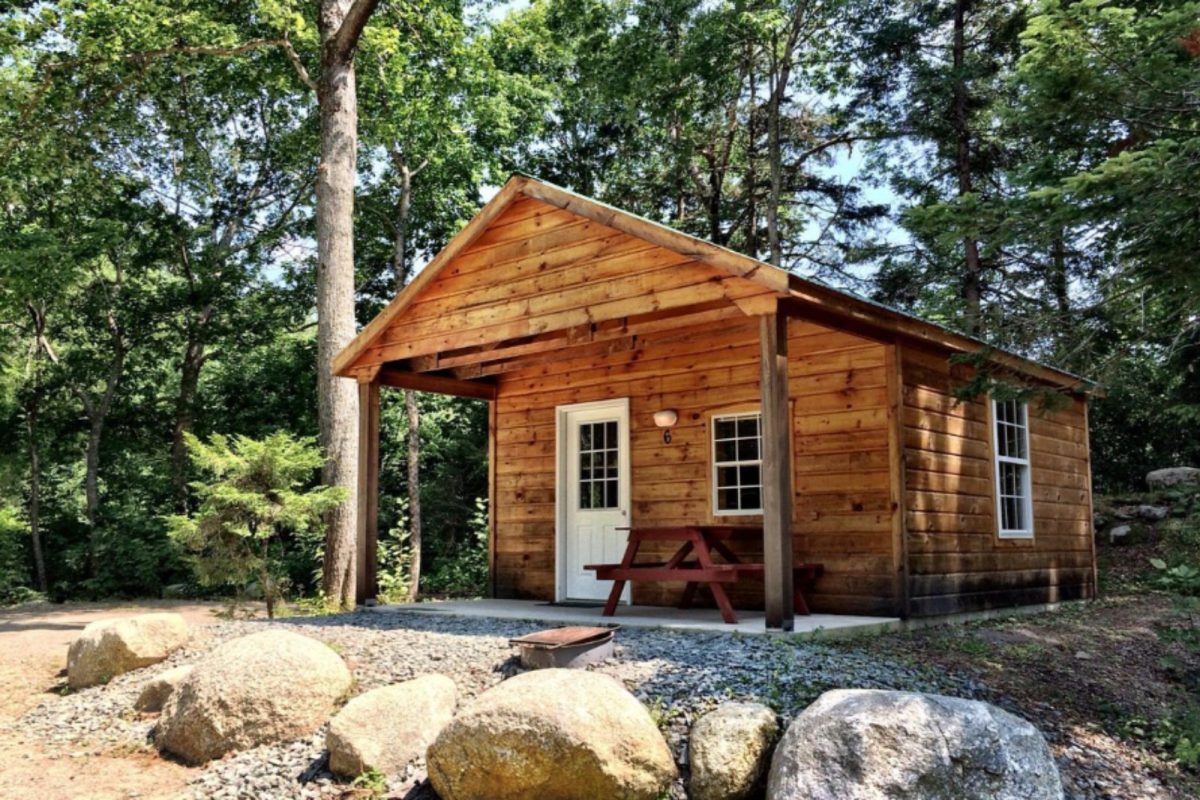 cabin surrounded by trees at Hadley's Point Campground near Acadia National Park