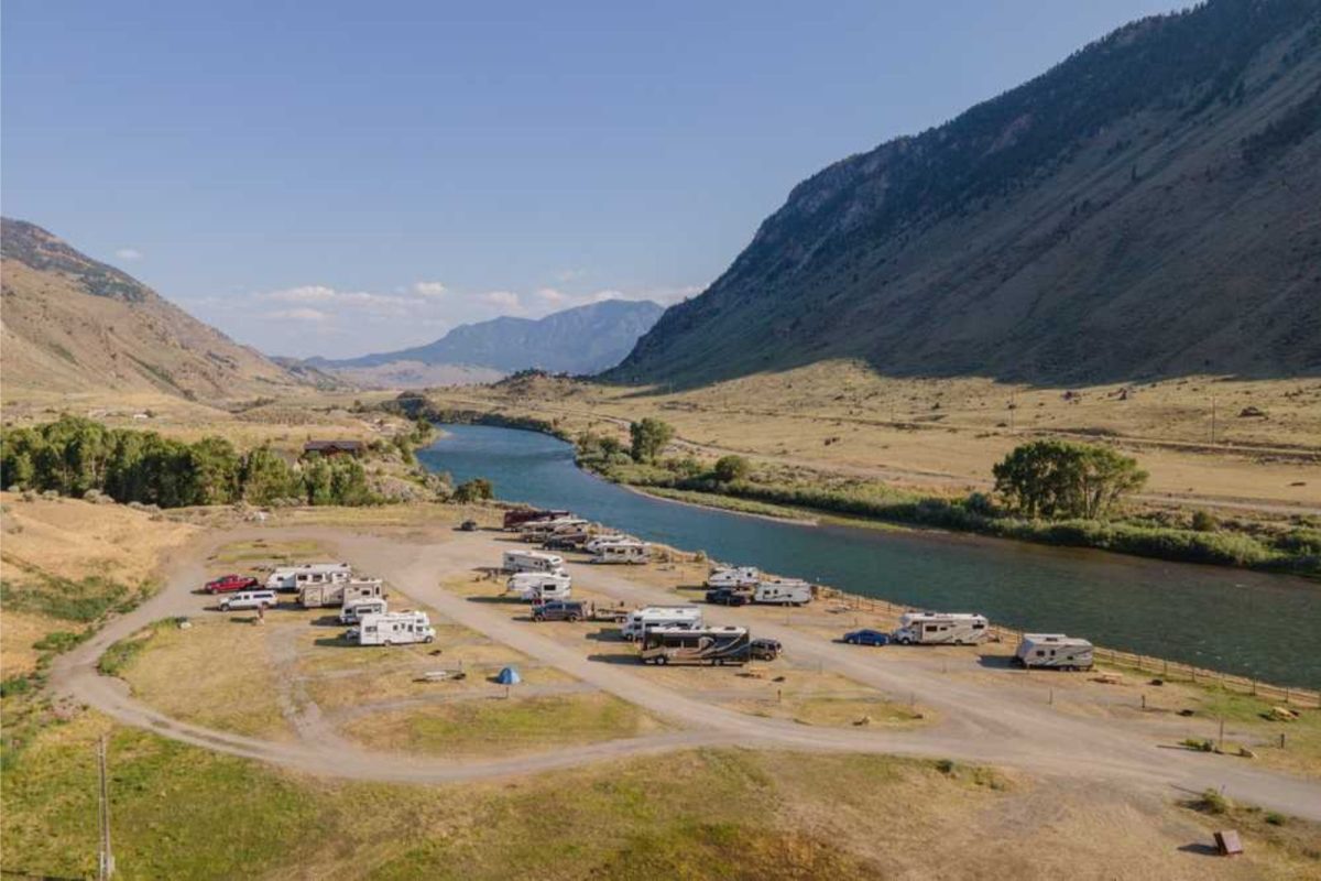 RVs parked at campground by river near Yellowstone National Park